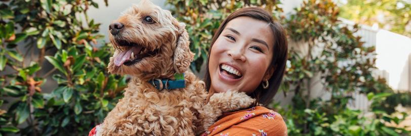 woman holding dog