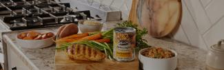 A can of food on a cutting board