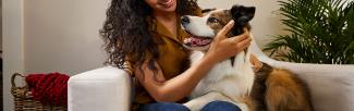 A woman holding a dog