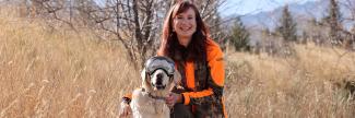 Dr Ruth Ann Image with Dog in a Field