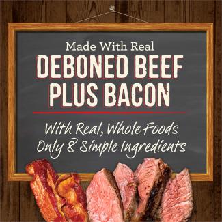 Cooked beef and cooked bacon and a chalk board with the words “Made with real deboned beef plus bacon. With real, whole foods. Only 8 simple ingredients.” 