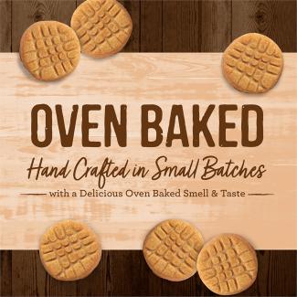 Oven Baked Paw’some Peanut Butter circular dog treats with a tan background that says “Oven baked hand crafted in small batches with a delicious oven baked smell & taste.” 